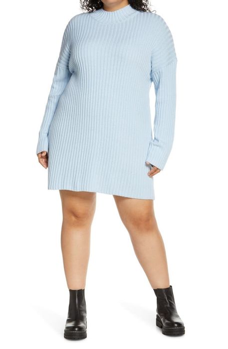 A model is showcasing the blue sweater dress.