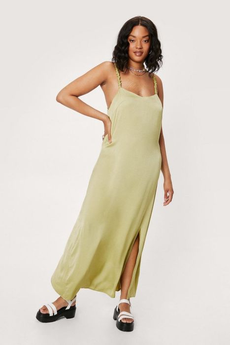 Model showcasing the satin dress in a beautiful green shade
