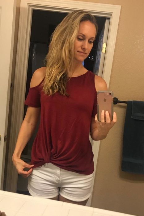 Reviewer showing off the top in red