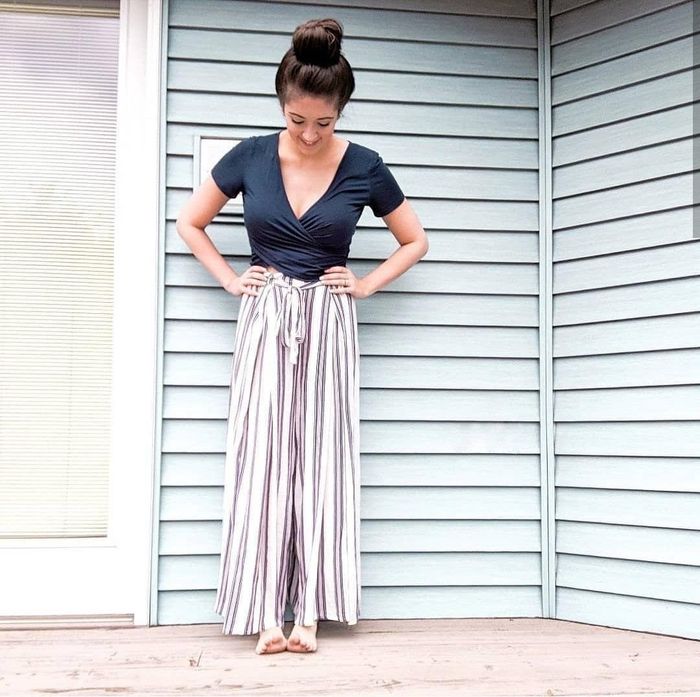 A reviewer confidently wearing the pants, embracing both comfort and style.