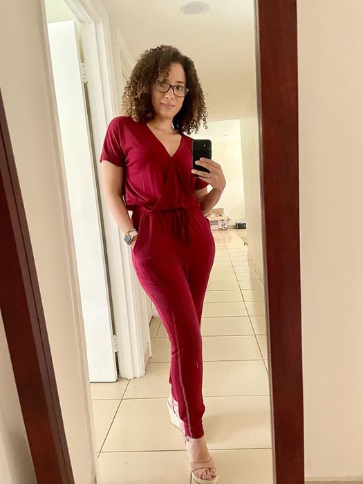 A reviewer is seen sporting a stylish jumpsuit.