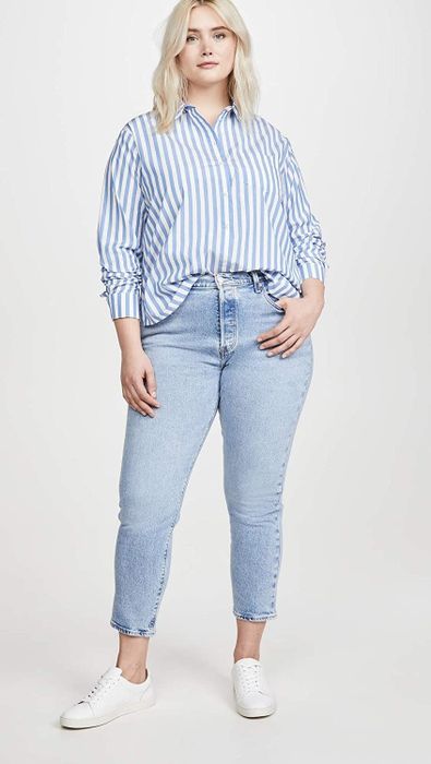 A plus-size model styles the light-wash version for a laid-back, effortless look.