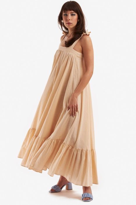 The dress in a soft beige shade.