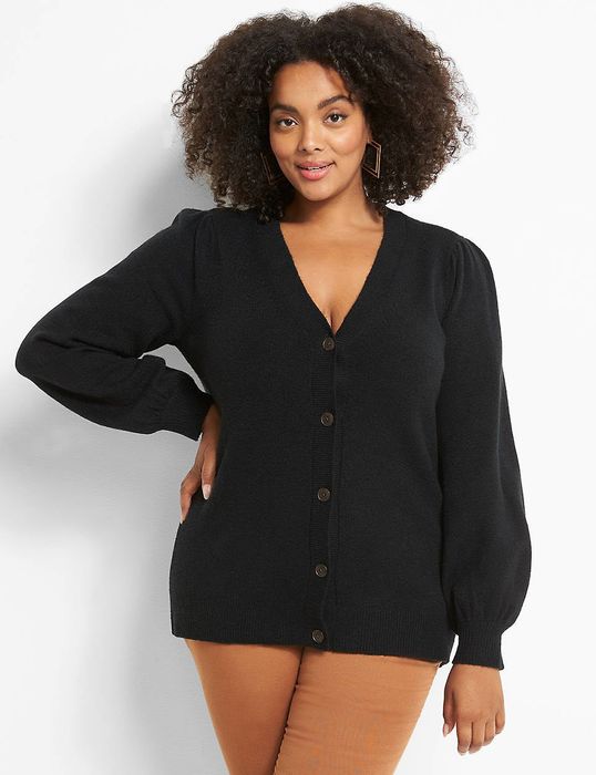 A model is wearing the black cardigan.
