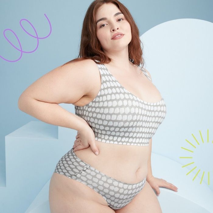 The model is wearing a gray spotted bralette.