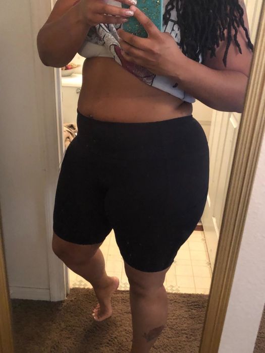The reviewer is seen sporting a pair of black bike shorts.