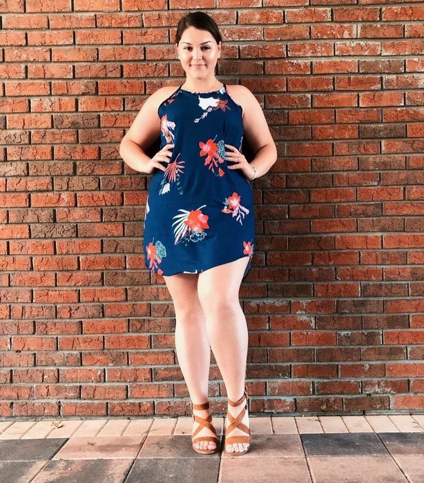 A reviewer showcasing the dress