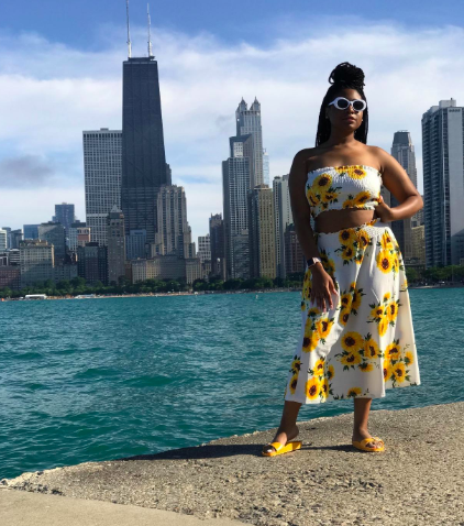 Reviewer wearing the sunflower print skirt paired with a tube top