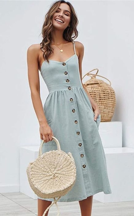 Model showcasing the sundress in a soft pale blue shade.