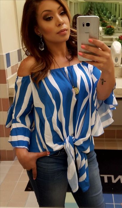 Reviewer styling the top in white and blue zebra stripes with jeans