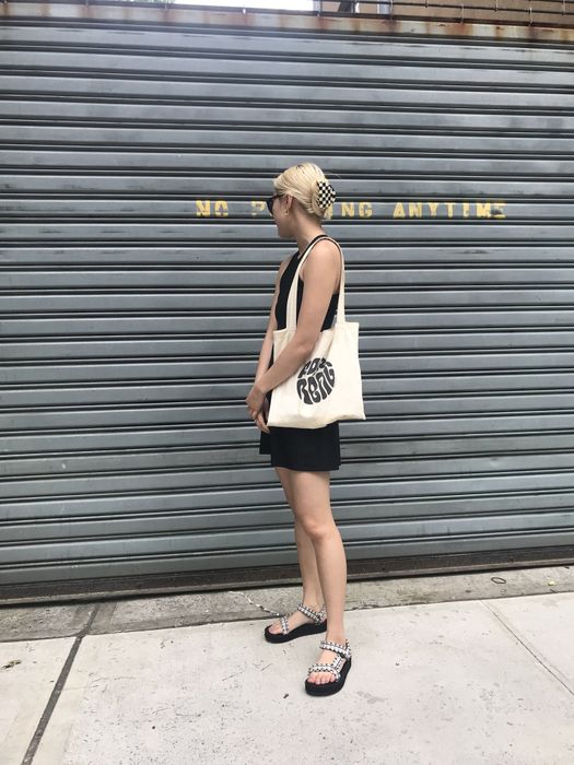 The Mytour editor styles the sandals with a high-neck A-line black dress for a chic yet comfy look.