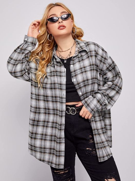 Model wearing the plaid shirt.
