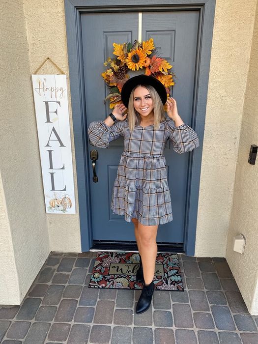 A reviewer showcasing the dress.