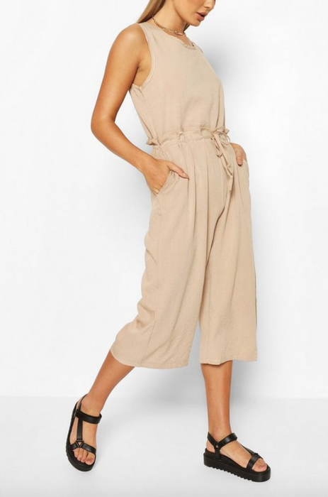 The jumpsuit in a warm camel shade.