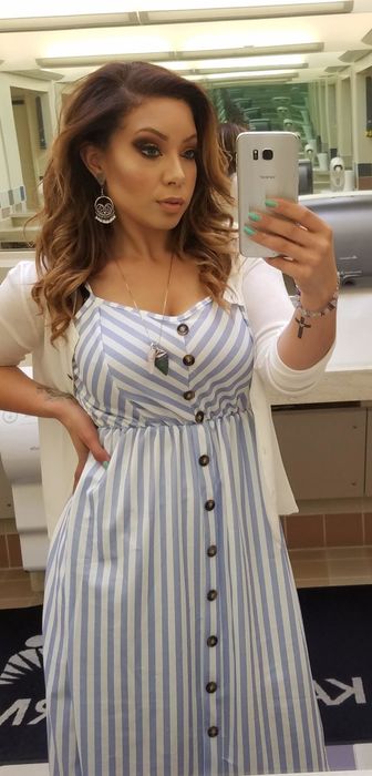 Reviewer sporting the dress with charming stripes for a fresh look.