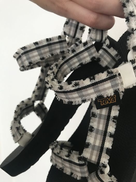 A close-up of the sandal straps highlighting the frayed details for a stylish touch.