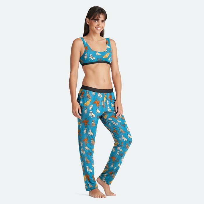 A model wears the blue version featuring adorable cartoon dogs for a playful and cozy vibe.