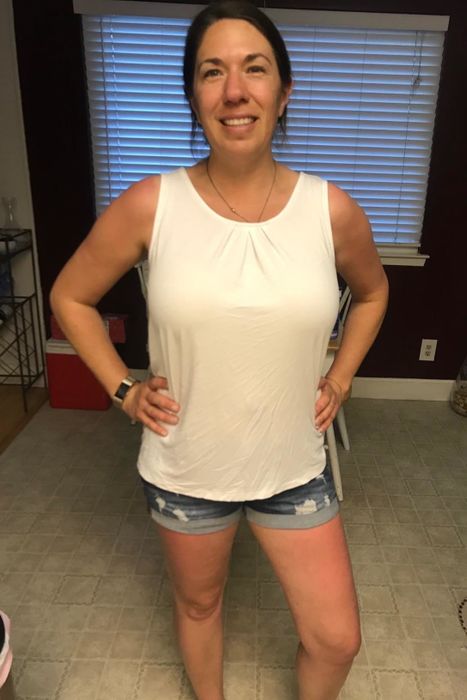 A reviewer wearing the crewneck tank in white