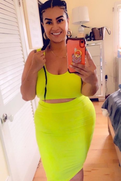 Another reviewer wearing the matching set in a bright lime green
