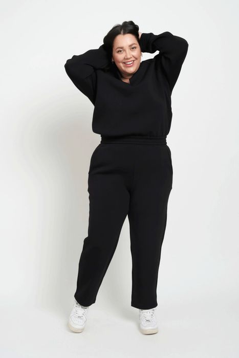 A model is wearing the black joggers.