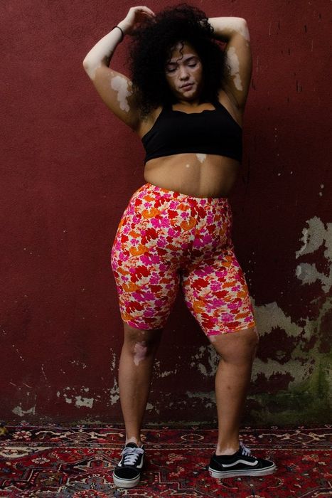 Another model showcasing the floral bike shorts.