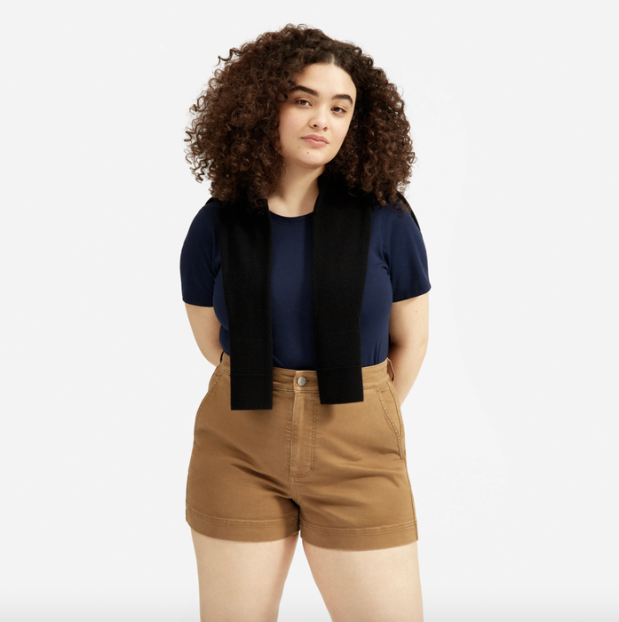 Model sporting the brown high-waisted shorts.
