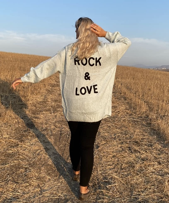 Reviewer showing the back of the sweater.
