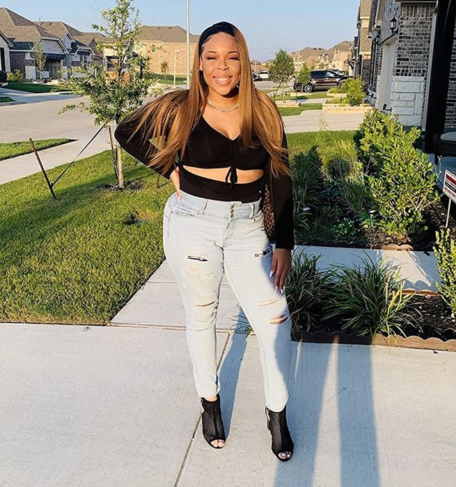 A reviewer flaunting the top in classic black.