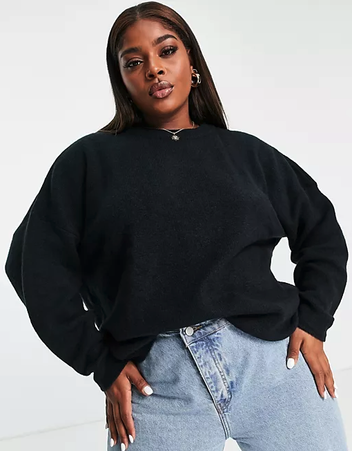 Model wearing a black sweater