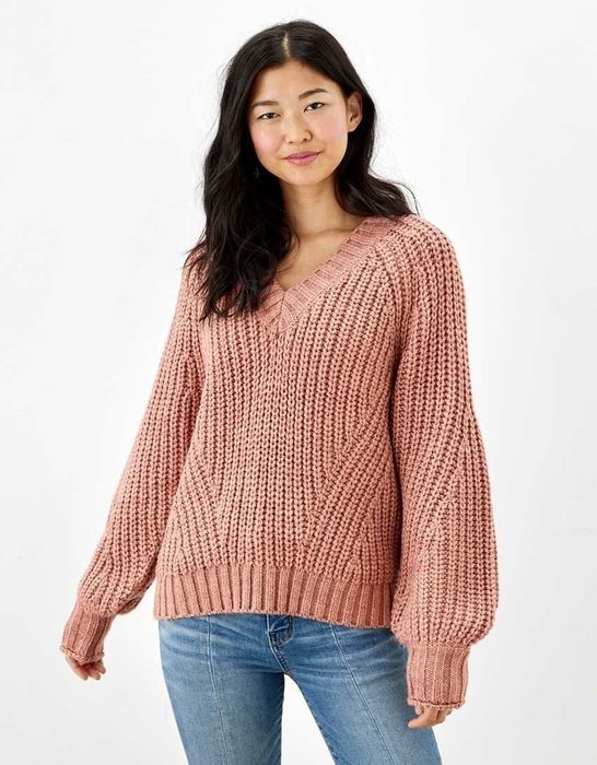 Model wearing a pink sweater