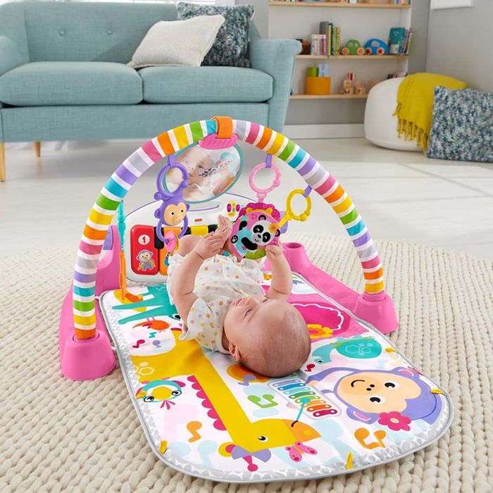 The Fisher-Price Kick and Play Piano in pink