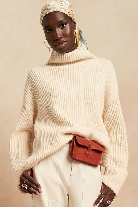 A model showcasing the sweater with matching pants.