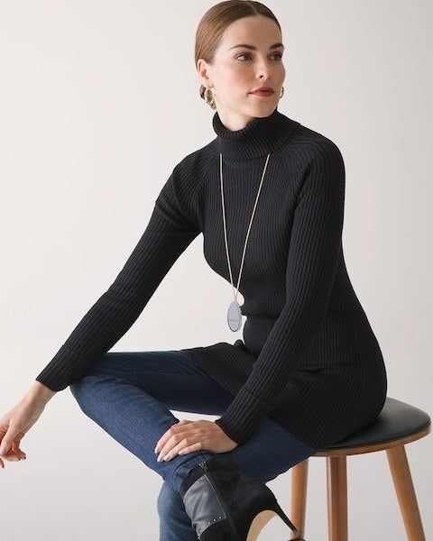 Model wearing a black tunic and jeans