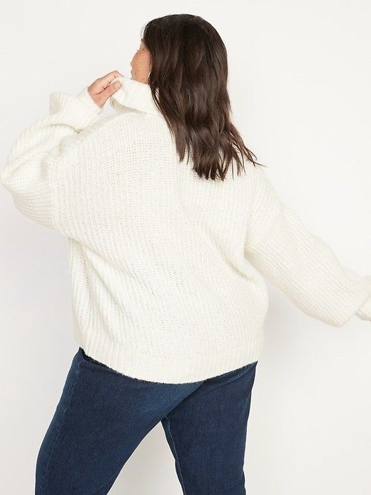 Model shown wearing a white sweater, back view.