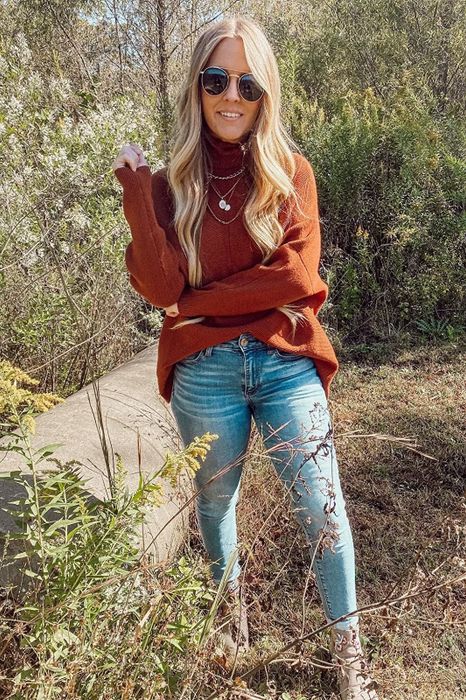 Reviewer wearing the orange sweater