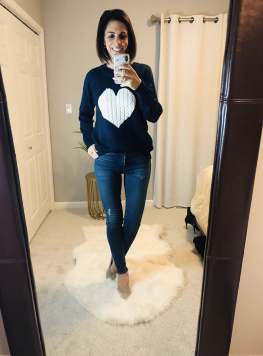 Reviewer wearing the heart sweater