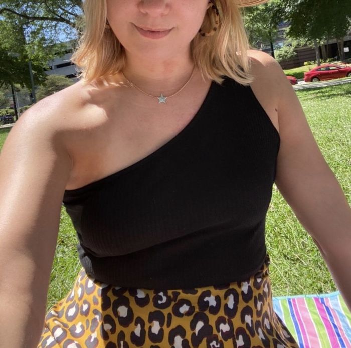 A reviewer wearing the top in black