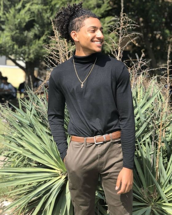 Reviewer modeling the black sweater