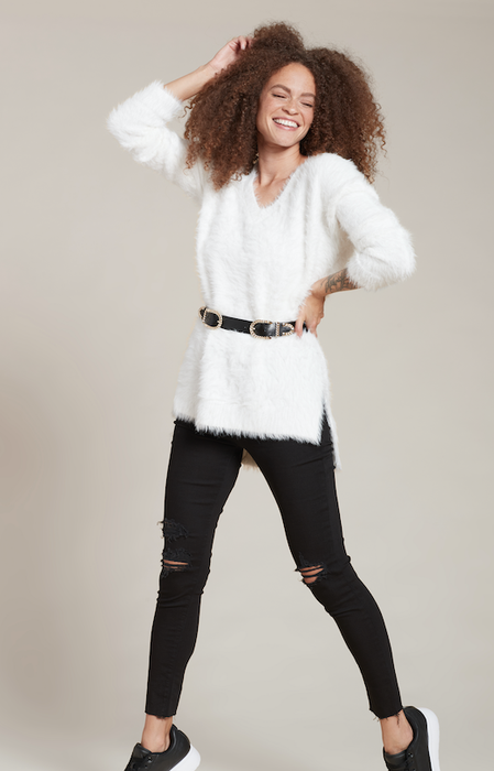A model wearing the cozy eyelash sweater.