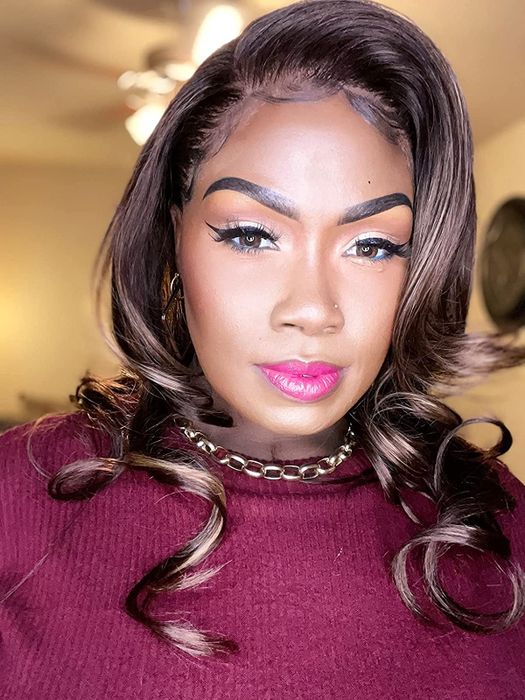 A reviewer showcasing a full face of makeup, looking flawless and glowing.