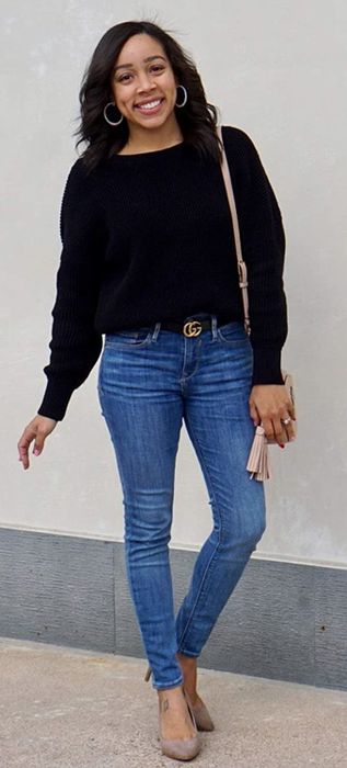 Front view of another model wearing the sweater in black