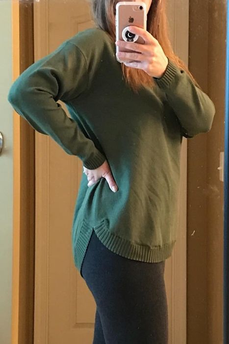 Reviewer sporting a green sweater