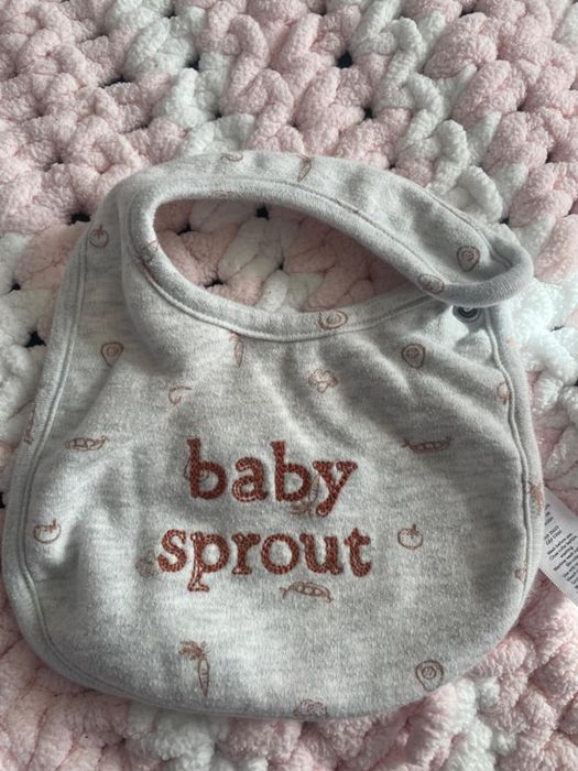 Gray-colored baby bib featuring