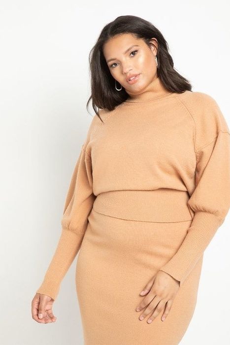 Model showcasing a tan sweater from the front