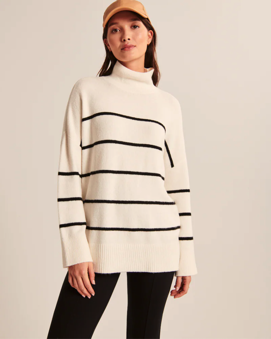 Model wearing a striped sweater