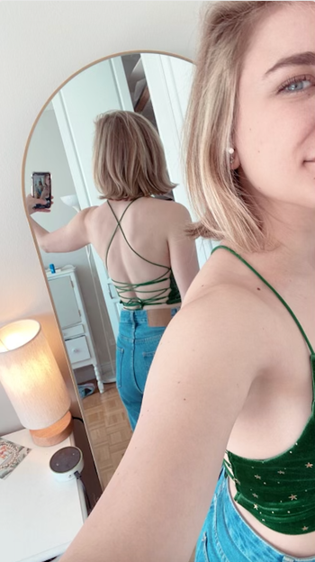 The back of the crop top featuring crisscrossed straps.