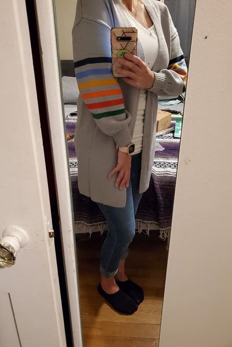 A reviewer opts for the gray version of the cardigan, showcasing its versatile charm.