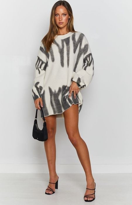 Model showcasing the sweater as a dress
