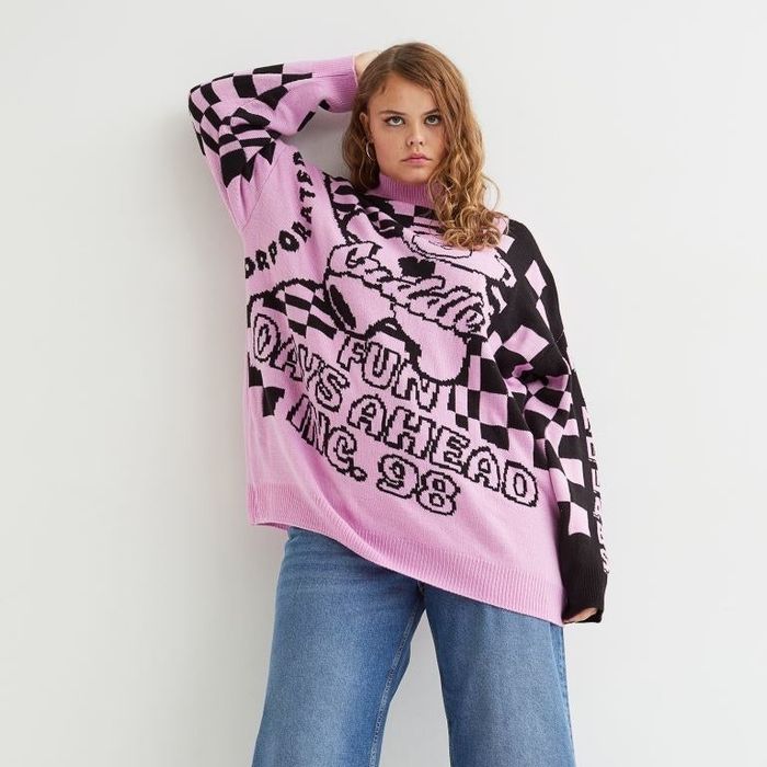 Model donning a pink sweater