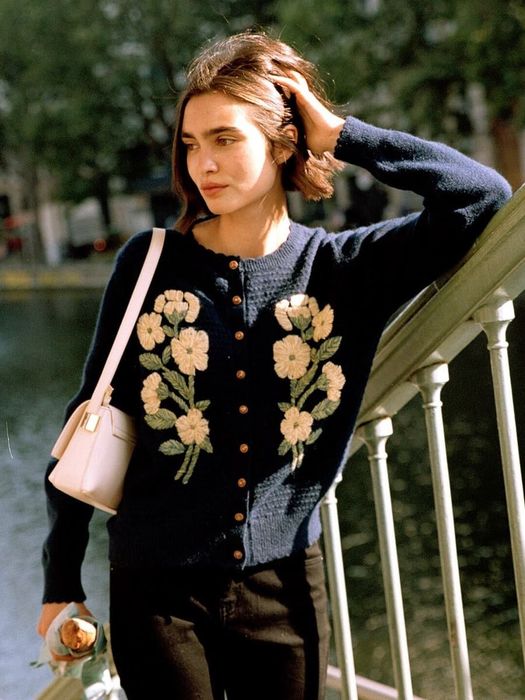 A model showcasing an embroidered sweater